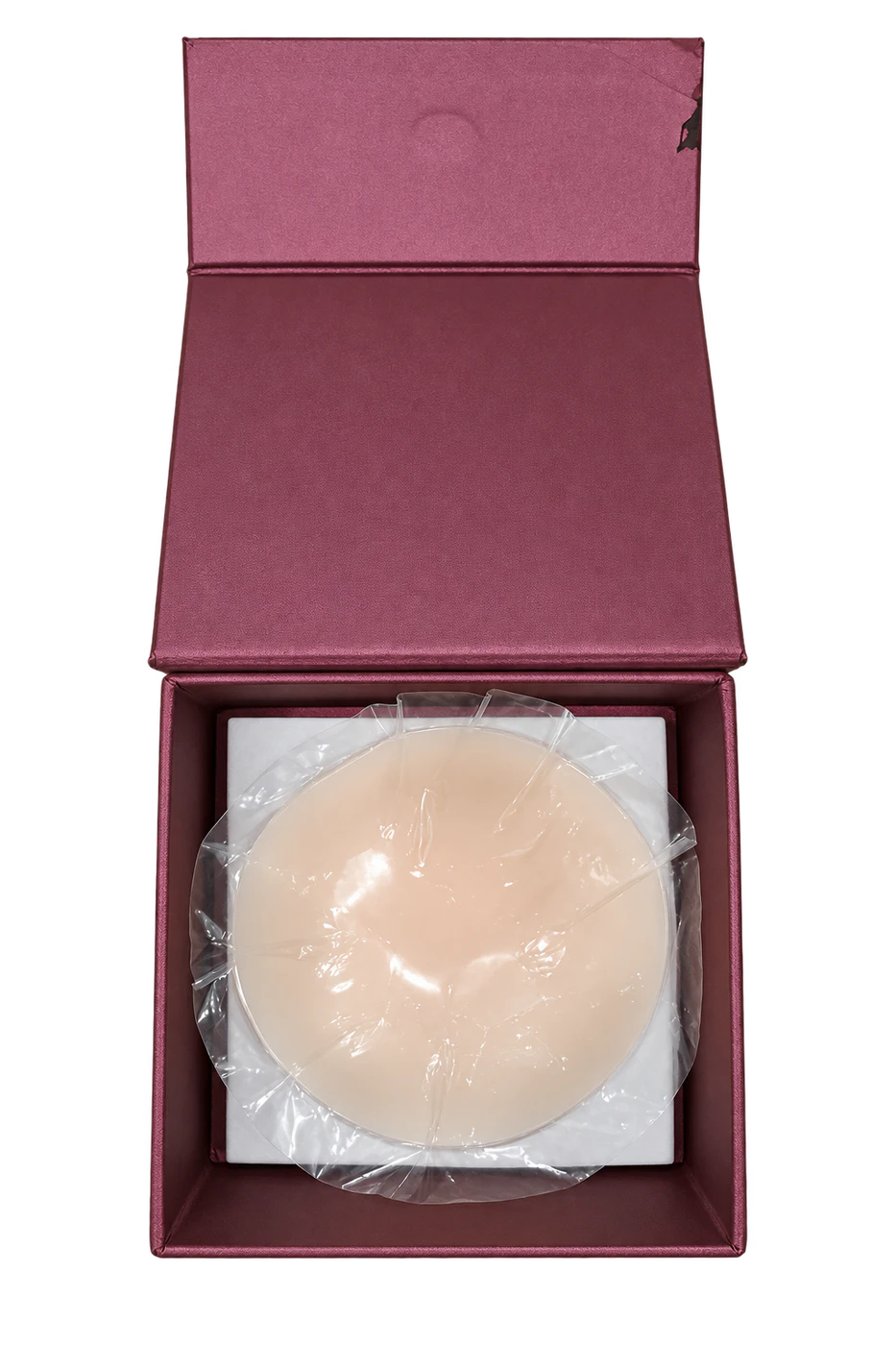 Open burgundy magnetic packaging box with wrapped silicone product
